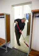26 March 2011; Former GAA president Nickey Brennan, a member of the host club Conahy Shamrocks, cleans out a dressing room in advance of the teams arriving. Allianz Football League, Division 4, Round 7, Kilkenny v Fermanagh, Conahy Shamrocks GAA Club, Jenkinstown, Co. Kilkenny. Picture credit: Ray McManus / SPORTSFILE