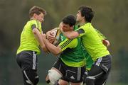 29 March 2011; Munster's Denis Leamy is tackled by Conor Murray and Ronan O'Gara, left, during squad training ahead of their Celtic League match against Leinster on Saturday. Munster Rugby Squad Training, CIT, Bishopstown, Cork. Picture credit: Diarmuid Greene / SPORTSFILE