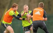 29 March 2011; Munster's Keith Earls is tackled by Stephen Archer, left, and Troy Smith during squad training ahead of their Celtic League match against Leinster on Saturday. Munster Rugby Squad Training, CIT, Bishopstown, Cork. Picture credit: Diarmuid Greene / SPORTSFILE