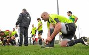 29 March 2011; Munster's John Hayes ties his laces before scrum practice during squad training ahead of their Celtic League match against Leinster on Saturday. Munster Rugby Squad Training, CIT, Bishopstown, Cork. Picture credit: Diarmuid Greene / SPORTSFILE