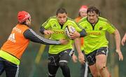 29 March 2011; Munster's Doug Howlett, supported by Tony Buckley, is tackled by Duncan Williams during squad training ahead of their Celtic League match against Leinster on Saturday. Munster Rugby Squad Training, CIT, Bishopstown, Cork. Picture credit: Diarmuid Greene / SPORTSFILE