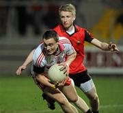 30 March 2011; Shea McGuigan, Tyrone, in action against Danny Savage, Down. Cadbury Ulster GAA Football Under 21 Championship Quarter-Final, 2nd Replay, Tyrone v Down, Athletic Grounds, Armagh. Picture credit: Oliver McVeigh / SPORTSFILE