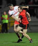 30 March 2011; Michael Higgins, Down, in action against Kyle Coney, Tyrone. Cadbury Ulster GAA Football Under 21 Championship Quarter-Final, 2nd Replay, Tyrone v Down, Athletic Grounds, Armagh. Picture credit: Oliver McVeigh / SPORTSFILE