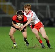 30 March 2011; Paul McPolin, Down, in action against Peter Harte, Tyrone. Cadbury Ulster GAA Football Under 21 Championship Quarter-Final, 2nd Replay, Tyrone v Down, Athletic Grounds, Armagh. Picture credit: Oliver McVeigh / SPORTSFILE
