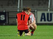 30 March 2011; Peter Harte, Tyrone, commiserates with Paul McPolin, Down, 11, after the final whistle. Cadbury Ulster GAA Football Under 21 Championship Quarter-Final, 2nd Replay, Tyrone v Down, Athletic Grounds, Armagh. Picture credit: Oliver McVeigh / SPORTSFILE