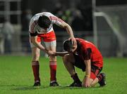 30 March 2011; Matthew Donnelly, Tyrone, left, commiserates with David McKibben, Down, after the final whistle. Cadbury Ulster GAA Football Under 21 Championship Quarter-Final, 2nd Replay, Tyrone v Down, Athletic Grounds, Armagh. Picture credit: Oliver McVeigh / SPORTSFILE