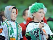 29 March 2011; Two young supporters watch the teams come out at the start of the match. International Friendly, Republic of Ireland v Uruguay, Aviva Stadium, Lansdowne Road, Dublin. Picture credit: Brian Lawless / SPORTSFILE
