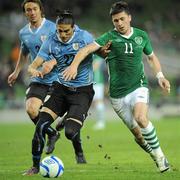 29 March 2011; Shane Long, Republic of Ireland, in action against Martin Cacedes, Uruguay. International Friendly, Republic of Ireland v Uruguay, Aviva Stadium, Lansdowne Road, Dublin. Picture credit: Brian Lawless / SPORTSFILE