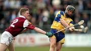 19 April 1998; Alan Markham of Clare gets in his shot away despite the blockdown attempt by Gregory Kennedy of Galway during the Church & General National Hurling League Division 1 match between Clare and Galway at Cusack Park in Ennis, Clare. Photo by Matt Browne/Sportsfile