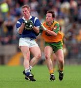21 June 1998; Anthony Forde of Cavan in action against Adrian Sweeney of Donegal during the Bank of Ireland Ulster Senior Football Championship Semi-Final match between Cavan and Donegal at St Tiernach's Park in Clones, Monaghan. Photo by Matt Browne/Sportsfile