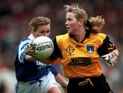 12 October 1997; Anita O'Reilly of Monaghan gets away from Aine Wall of Waterford during the All-Ireland Senior Ladies Football Championship Final between Monaghan and Waterford at Croke Park in Dublin. Photo by Matt Browne/Sportsfile