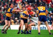 12 July 1998; Brian Lohan of Clare, 3, and Michael White, 13, both wearing red helmets in a tussle, who were subsequently sent off by Referee Willie Barrett during the Guinness Munster Senior Hurling Championship Final match between Clare and Waterford at Semple Stadium in Thurles, Tipperary. Photo by Ray McManus/Sportsfile