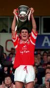12 July 1998; Cork captain Cathal McCarthy lifts the TWA Cup following the Munster Minor Hurling Championship Final match between Cork and Clare at Semple Stadium in Thurles, Tipperary. Photo by Ray McManus/Sportsfile