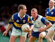 28 June 1998; Conor O'Dwyer of Tipperary in action against Martin Daly of Clare during the Bank of Ireland Munster Senior Football Championship Semi-Final match between Tipperary and Clare at the Gaelic Grounds in Limerick. Photo by Brendan Moran/Sportsfile