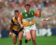 3 September 1995; Daithi Regan of Offaly is tackled by Ollie Baker of Clare during the Guinness All-Ireland Senior Hurling Championship Final between Clare and Offaly at Croke Park in Dublin. Photo by Ray McManus/Sportsfile