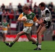 2 August 1998; Darren Quinn of Offaly is tackled by Michael Durcan of Sligo during the All-Ireland Junior Football Championship Semi-Final between Offaly and Sligo at Dr Hyde Park in Roscommon. Photo by Matt Browne/Sportsfile