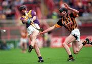 5 July 1998; Ger Coleman of Wexford is tackled by James Ryall of Kilkenny during the Leinster Minor Hurling Championship Final match between Kilkenny and Wexford at Croke Park in Dublin. Photo by Ray Lohan/Sportsfile