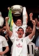 2 August 1998; Kildare captain Glenn Ryan lifts the Delaney Cup behind his team-mate Anthony Rainbow following the Bank of Ireland Leinster Senior Football Championship Final match between Kildare and Meath at Croke Park in Dublin. Photo by David Maher/Sportsfile