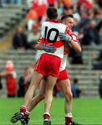 28 June 1998; Derry's Dermot Dougan celebrates with team-mate Eamonn Burns following the Bank of Ireland Ulster Senior Football Championship Semi-Final match between Armagh and Derry at St Tiernach's Park in Clones, Monaghan. Photo by David Maher/Sportsfile