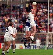 19 July 1998; Dermot Earley of Kildare goes up for a high ball with Tony Maher and Derek Conroy of Laois during the Bank of Ireland Leinster Senior Football Championship Semi-Final at Croke Park in Dublin. Photo by Brendan Moran/Sportsfile