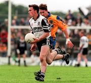 28 June 1998; Dessie Sloyne of Sligo in action against Clifford McDonald of Roscommon during the Bank of Ireland Connacht Senior Football Championship Semi-Final match between Roscommon and Sligo at Dr Hyde Park in Roscommon. Photo by Matt Browne/Sportsfile