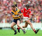21 June 1998; Jamesie O'Connor of Clare in action against Brian Corcoran of Cork during the Guinness Munster Senior Hurling Championship Semi-Final match between Clare and Cork at Semple Stadium in Thurles, Tipperary. Photo by Ray McManus/Sportsfile
