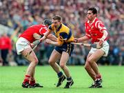 21 June 1998; Jamesie O'Connor of Clare in action against Brian Corcoran and Sean Og O'hAilpin, right, of Cork during the Guinness Munster Senior Hurling Championship Semi-Final match between Clare and Cork at Semple Stadium in Thurles, Tipperary. Photo by Ray McManus/Sportsfile