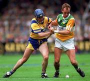 3 September 1995; Joe Dooley of Offaly is tackled by Sean McMahon of Clare during the Guinness All-Ireland Senior Hurling Championship Final between Clare and Offaly at Croke Park in Dublin. Photo by Ray McManus/Sportsfile