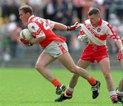 28 June 1998; John McEnteey of Armagh is tackled by Dermot Dougan of Derry during the Bank of Ireland Ulster Senior Football Championship Semi-Final match between Armagh and Derry at St Tiernach's Park in Clones, Monaghan. Photo by David Maher/Sportsfile