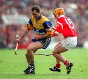 21 June 1998; Liam Doyle of Clare in action against Joe Deane of Cork during the Guinness Munster Senior Hurling Championship Semi-Final match between Clare and Cork at Semple Stadium in Thurles, Tipperary. Photo by Ray McManus/Sportsfile