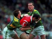 21 July 1996; Mark O'Connor of Cork in action against Geni Farrell, 13, and and Dara Ó Cinnéide of Kerry during the Bank of Ireland Munster Senior Football Championship Final match between Cork and Kerry at Páirc Uí Chaoimh in Cork. Photo by Brendan Moran/Sportsfile