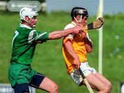 21 June 1998; Liam Richmond of Antrim in action against Billy Dolan of London during the Guinness Ulster Senior Hurling Championship Semi-Final Replay match between Antrim and London at Casement Park in Belfast, Antrim. Photo by Damien Eagers/Sportsfile