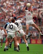 21 June 1998; Kildare's Niall Buckley jumps highest against Dublin's Brian Stynes as his team-mates Willie McCreery and  Eddie McCormack watch on during the Bank of Ireland Leinster Senior Football Championship Quarter-Final Replay match between Kildare and Dublin at Croke Park in Dublin. Photo by David Maher/Sportsfile
