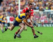 21 June 1998; Ollie Baker of Clare in action against Michael Daly of Cork during the Guinness Munster Senior Hurling Championship Semi-Final match between Clare and Cork at Semple Stadium in Thurles, Tipperary. Photo by Ray McManus/Sportsfile