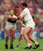 3 August 1997; Tommy Dowd of Meath is tackled by Glenn Ryan of Kildare during the Bank of Ireland Leinster Senior Football Championship Semi-Final Second Replay match between Meath and Kildare at Croke Park in Dublin. Photo by Ray McManus/Sportsfile