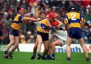 19 July 1998; Clare's Brian Lohan, 3, and Waterford's Michael White, 13, both wearing red helmets tussle before being sent off by referee Willie Barrett during the Guinness Munster Senior Hurling Championship Final Replay match between Clare and Waterford at Semple Stadium in Thurles, Tipperary. Photo by Ray McManus/Sportsfile