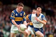 28 June 1998; Niall Kelly of Tipperary in action against Michael Liddane of Clare during the Bank of Ireland Munster Senior Football Championship Semi-Final match between Tipperary and Clare at the Gaelic Grounds in Limerick. Photo by Brendan Moran/Sportsfile