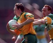 12 April 1998; Noel McGinley of Donegal in action against James Stewart of Offaly during the Church & General National Football League Semi-Final match between Donegal and Offaly at Croke Park in Dublin. Photo by Ray McManus/Sportsfile