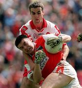 28 June 1998; Oisin McConville of Armagh in action against Sean Martin Lockhart of Derry during the Bank of Ireland Ulster Senior Football Championship Semi-Final match between Armagh and Derry at St Tiernach's Park in Clones, Monaghan. Photo by David Maher/Sportsfile