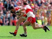 28 June 1998; Oisin McConville of Armagh in action against Kieran McKeever of Derry during the Bank of Ireland Ulster Senior Football Championship Semi-Final match between Armagh and Derry at St Tiernach's Park in Clones, Monaghan. Photo by David Maher/Sportsfile