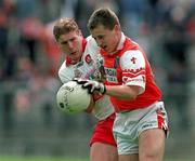 28 June 1998; Patrick McKeever of Armagh is tackled by Paul Diamond of Derry during the Bank of Ireland Ulster Senior Football Championship Semi-Final match between Armagh and Derry at St Tiernach's Park in Clones, Monaghan. Photo by David Maher/Sportsfile