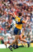 12 July 1998; Peter Queally of Waterford in action against Ollie Baker of Clare, 9, during the Guinness Munster Senior Hurling Championship Final match between Clare and Waterford at Semple Stadium in Thurles, Tipperary. Photo by Ray McManus/Sportsfile