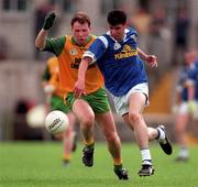 21 June 1998l Raphael Rogers of Cavan is tackled by Manus Boyle of Donegal during the Bank of Ireland Ulster Senior Football Championship Semi-Final match between Cavan and Donegal at St Tiernach's Park in Clones, Monaghan. Photo by Matt Browne/Sportsfile