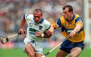 12 July 1998; Peter Queally of Waterford in action against Ollie Baker of Clare during the Guinness Munster Senior Hurling Championship Final match between Clare and Waterford at Semple Stadium in Thurles, Tipperary. Photo by Ray McManus/Sportsfile