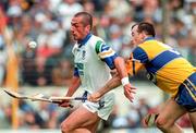 12 July 1998; Peter Queally of Waterford in action against Ollie Baker of Clare during the Guinness Munster Senior Hurling Championship Final match between Clare and Waterford at Semple Stadium in Thurles, Tipperary. Photo by Ray McManus/Sportsfile