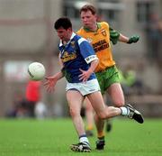 21 June 1998; Raphael Rogers of Cavan is tackled by Manus Boyle of Donegal during the Bank of Ireland Ulster Senior Football Championship Semi-Final match between Cavan and Donegal at St Tiernach's Park in Clones, Monaghan. Photo by Matt Browne/Sportsfile