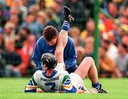 12 July 1998; Sean Cullinane of Waterford receives attention during the Guinness Munster Senior Hurling Championship Final match between Clare and Waterford at Semple Stadium in Thurles, Tipperary. Photo by Ray McManus/Sportsfile