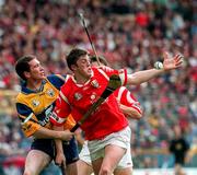 21 June 1998; Sean O'Farrell of Cork in action against Brian Quinn of Clare during the Guinness Munster Senior Hurling Championship Semi-Final match between Clare and Cork at Semple Stadium in Thurles, Tipperary. Photo by Ray McManus/Sportsfile