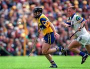 12 July 1998; Sean McMahon of Clare races clear of Ken McGrath of Waterford during the Guinness Munster Senior Hurling Championship Final match between Clare and Waterford at Semple Stadium in Thurles, Tipperary. Photo by Ray McManus/Sportsfile