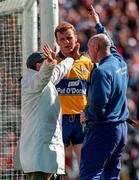 12 July 1998; Waterford coach Shane Ahern makes a point to the umpire watched by Brian Lohan of Clare during the Guinness Munster Senior Hurling Championship Final match between Clare and Waterford at Semple Stadium in Thurles, Tipperary. Photo by Ray McManus/Sportsfile